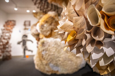 A close up image of rolled pages that make up a massive artwork display at the Everhart Museum in Scranton, PA.