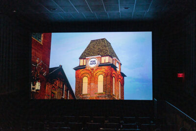 A still shot of the Penn Paper building that appeared on a movie theater screen at the Scranton Art Haus in Scranton, PA.