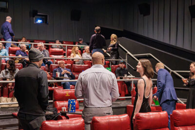 A man and woman standing with their backs to the camera are engaged in conversation at the Scranton Art Haus in Scranton, PA.