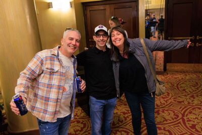 Two men and a woman pose for a photo inside the F.M. Kirby Center for the Performing Arts in Wilkes-Barre, P.A.