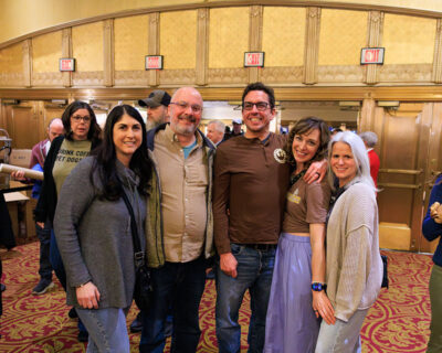 A group of people pose for a photo inside the F.M. Kirby Center for the Performing Arts in Wilkes-Barre, P.A.