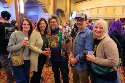 A group of people pose for a photo inside the F.M. Kirby Center for the Performing Arts in Wilkes-Barre, P.A.