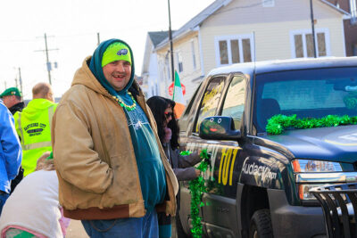 A man smiles for the camera at the second annual St. Patrick's Day Parade in Nanticoke, PA.