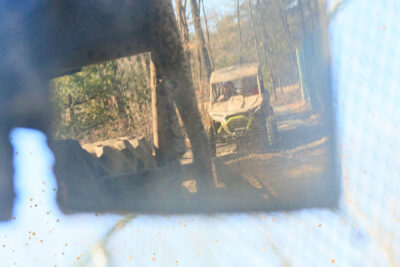 Point of view image from the passenger seat of an off road vehicle in the side mirror at Pocono Outdoor Adventure Tours in Long Pond, PA.