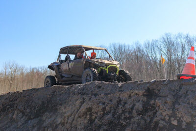 An off-road vehicle climbing a hill at Pocono Outdoor Adventure Tours in Long Pond, PA.