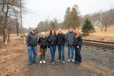 Passengers waiting for the train smile for the camera at The Village At Houser's Crossing in Tamaqua, PA.