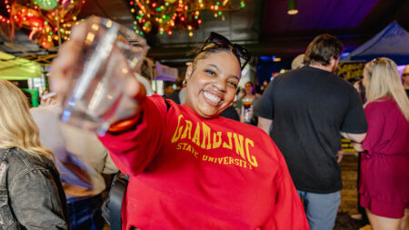 A woman holds up a glass for the camera during Brewfest at Montage Mountain in Scranton, PA.