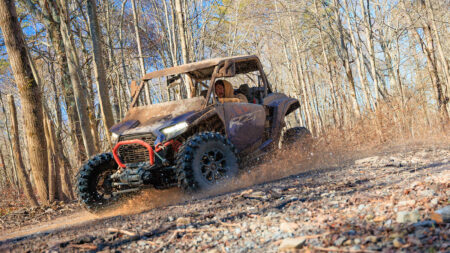 A driver takes an off-roading vehicle through the mud at Pocono Outdoor Adventure Tours in Long Pond, PA.