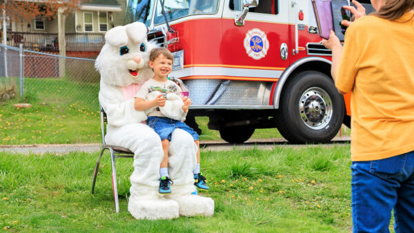 Easter Bunny holding a little boy for a photo op at the Easter Egg Hunt in Jenkins Twp., PA.