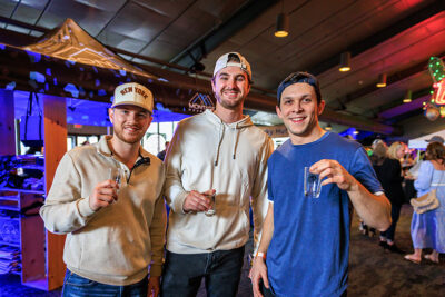 Three men smile for the camera during Brewfest at Montage Mountain in Scranton, PA.