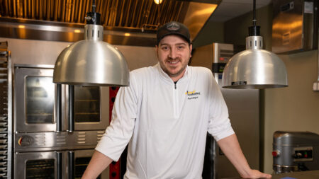 John Carsia, co-founder of Retro Dough and kitchen manager at the Hazleton Kitchen Incubator, poses in the kitchen in Hazleton, PA.