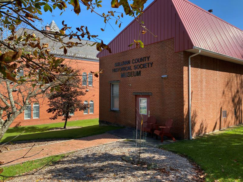 An exterior view of the red brick Sullivan County Historical Society in Laporte, PA.