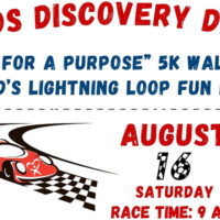 Promotional Graphic. White background with a depiction of a race car on a track. Text reads: 