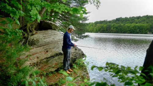 A fisherman casts a line into Frances Slocum Lake at Frances Slocum State Park in Wyoming, PA.