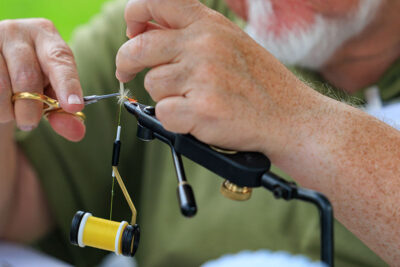 A close up of a fly-tying demonstration during the 2025 River of the Year celebration at Minisink Park in East Stroudsburg, PA.