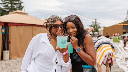 Two Women enjoying drinks pool side at Adult Night at Montage Mountain Waterpark in Scranton, PA.