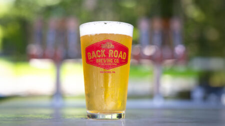 A lone pint of beer sits on the outdoor patio bar at Back Road brewing Co. in Milford, PA.
