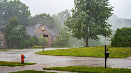 A view of a neighborhood during a thunderstorm.
