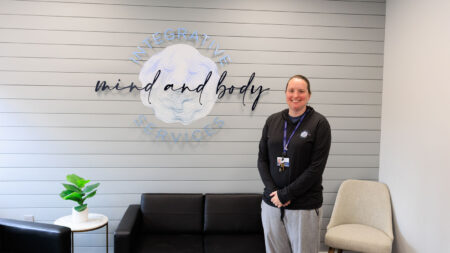 Alyse Kerr, President and CEO of Integrative Counseling Services and founder of the nonprofit Integrative Mind and Body Services, standing in her office in Scranton, PA.