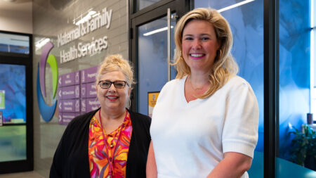 Cindy Kennedy and Betsy Ardizoni pose in the lobby of the Maternal & Family Health Services Circle of Care in Scranton, PA.