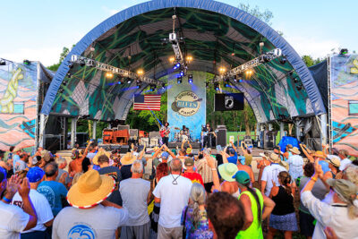 A band performs on stage at the Briggs Farm Blues Festival in Nescopeck, PA.