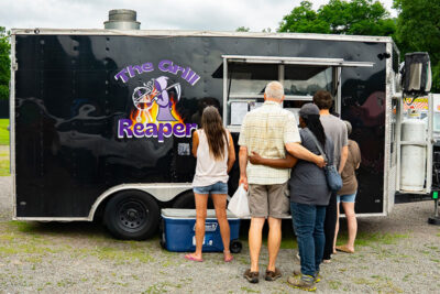 Customers lined up for The Grill Reaper Food truck