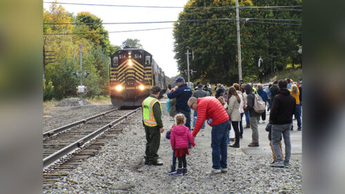 Families lining up to board the Excursion to Gouldsboro for the Family Fun & Pumpkin Patch ride.