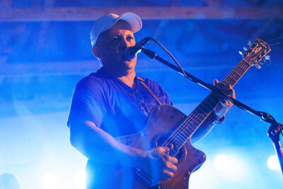A guitar player sings and plays on stage during Rockin' the Mountain at City View Park in Hazleton, PA.