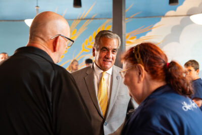 A crowd mingles at an A250PA event