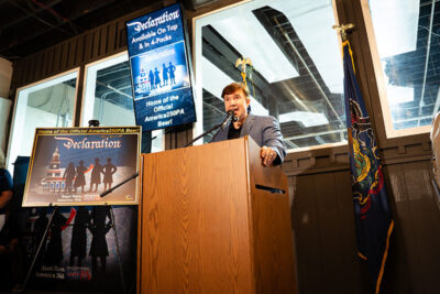Vince Benedetto speaks at a podium