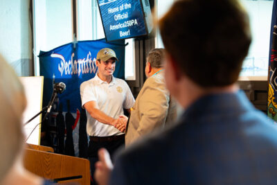Representative Rob Bresnahan walks up to a podium to speak