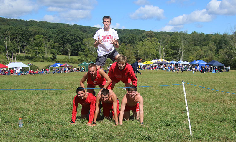 Boys from the Crestwood team build a pyramid at the annual Cliff Robbins Sr. Memorial, hosted by the Wyoming Valley Striders in Dallas, PA.