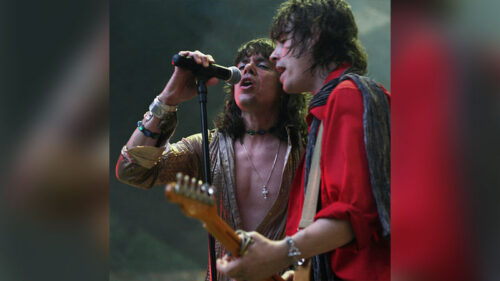 Classic Stones Live spring concert tribute to The Rolling Stones at Mauch Chunk Opera House in Jim Thorpe on April 11, 2026, featuring two performers singing and playing guitar on stage under concert lighting.