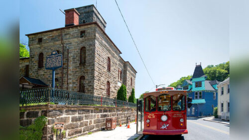The Jim Thorpe trolley company's trolley going down the stone street in Jim Thorpe, PA.