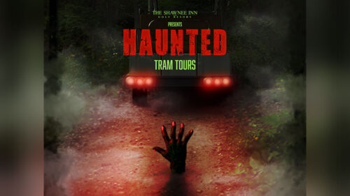 A graphic depiction of a monstrous hand reaching into the darkness for the Haunted tram Tour at Shawnee Inn and Golf Resort in Shawnee on Delaware, PA.