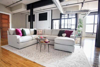 A view of a fully-furnished living room space inside an apartment in the Waterfront Warehouse in Pittston, PA.