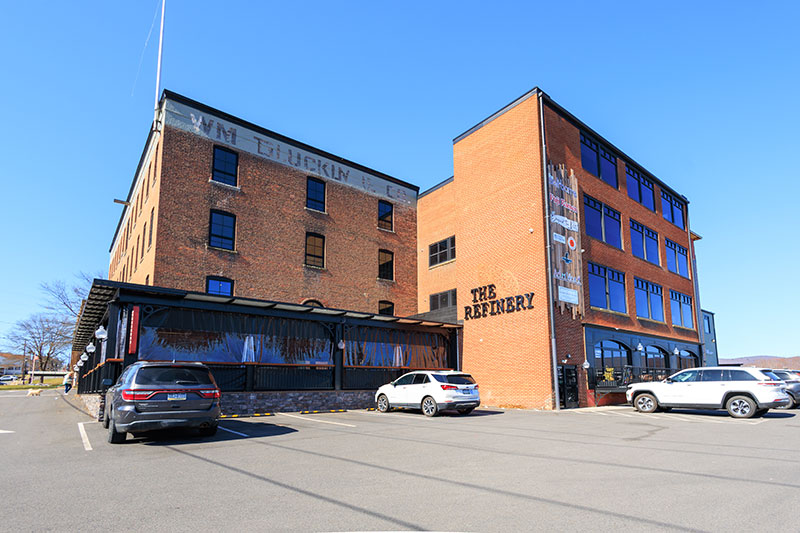 An exterior view of The Refinery, a restaurant on the first floor of the Waterfront Warehouse complex in Downtown Pittston, PA.