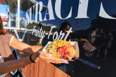 A dish of pork nachos held up in front of a food truck at the Boots & Brews Music Festival at Clubhouse 315 in Wilkes-Barre, PA.