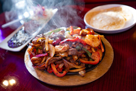 A plat of sizzling fajitas from Eros Cafe & Mexican Grill in Mountain Top, PA.