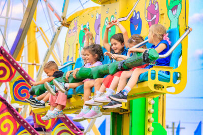 A group of children enjoy the rides at the Luzerne County Fair in Dallas, PA.
