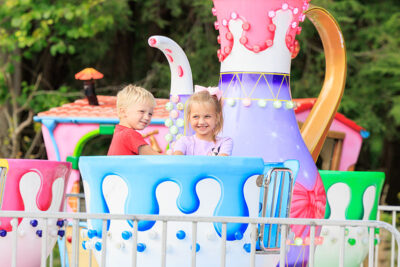 Two children smile while enjoying the rides at the Luzerne County Fair in Dallas, PA.