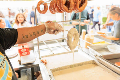 Donut rings are dipped in icing at the Luzerne County Fair in Dallas, PA.