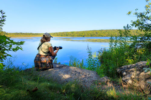 A girl admires the view of the lake from a rock at Tobyhanna State Park in Tobyhanna, PA.
