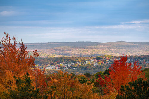 Fiery red leaves frame a view of the mountain at McDade Park