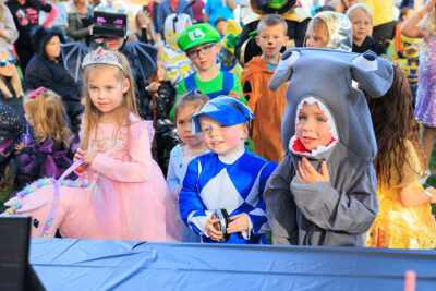Children dressed in various costumes anxiously await the announcement of the winners of the costume contest at Dymond's Farm and Farm Market in Dallas, PA.