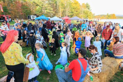 A crowd watches children in costume enjoy the dance party at Dymond's Farm and Farm Market in Dallas, PA.