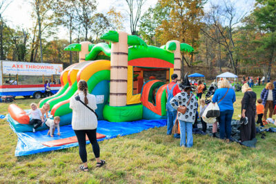 Three children climb out of a bounce house at Dymond's Farm and Farm Market in Dallas, PA.