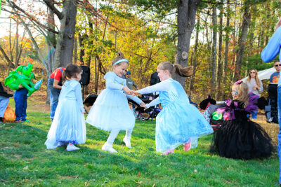 Two girls dressed as Elsa spin each other around at Dymond's Farm and Farm Market in Dallas, PA.
