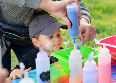 A boy eagerly watches as blue sand fills his sand glass creation at Dymond's Farm and Farm Market in Dallas, PA.