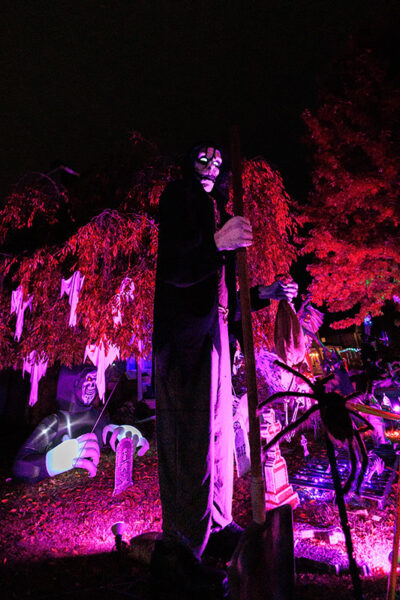 A festive home decorated with skeletons and ghosts in Halloweentown in West Pittston, PA.